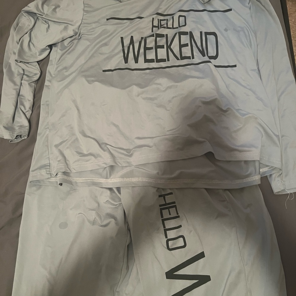 Two sets of pajamas one has kittens on it and the other says hello weekend